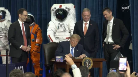 Executive order establishing a commission to design the United States Space Academy is signed at Johnson Space Center