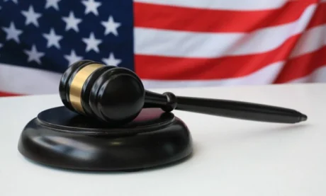 Judge’s gavel in front of the United States flag