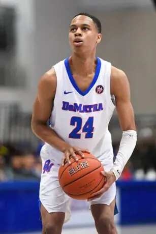 Jordan Hawkins playing basketball for DeMatha Catholic