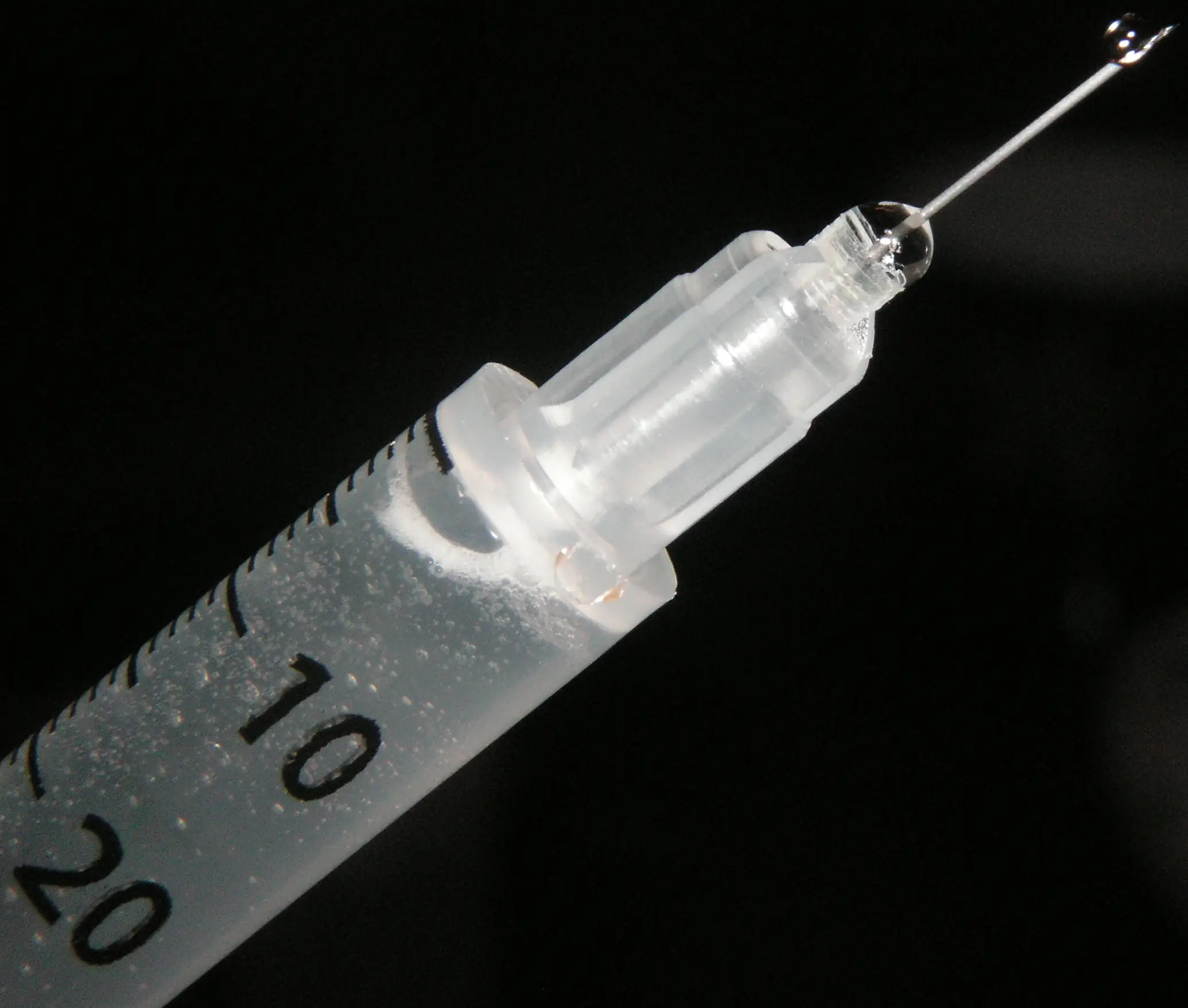Close-up photograph of a medical syringe and needle