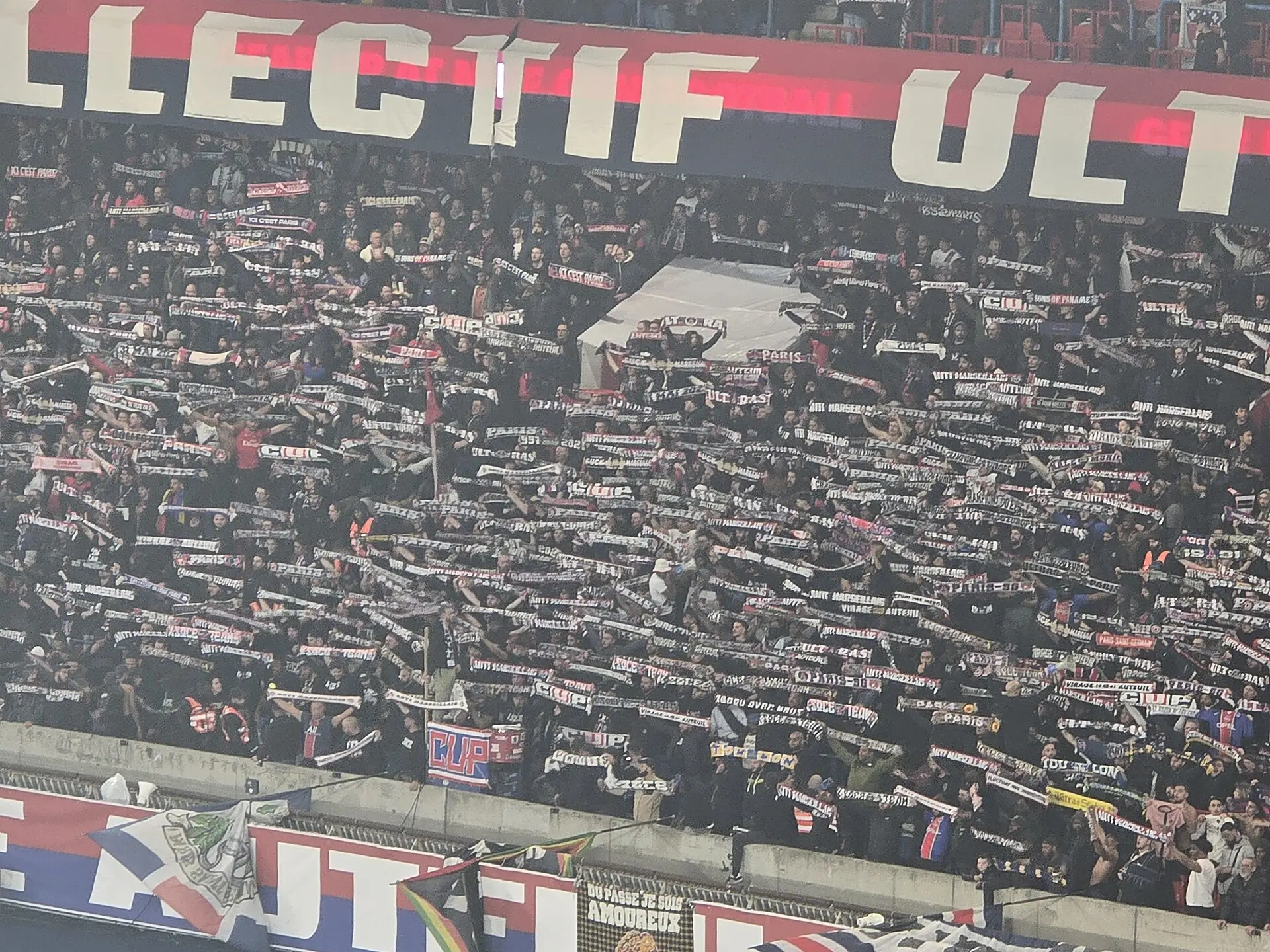 Paris Saint-Germain supporters holding scarves during a February 2026 match