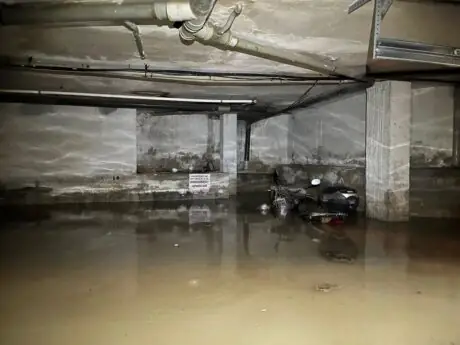 Floodwater surrounds a motor scooter inside an Ibiza garage in a UME photograph published during DANA Adam on October 19, 2026