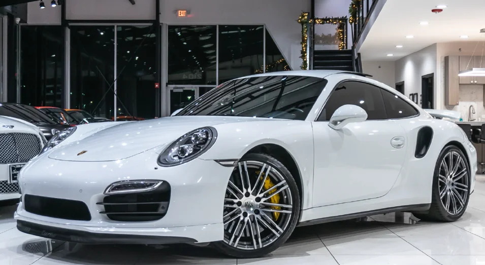 White Porsche 911 shown in the Justice Department’s Britton-Harr case release