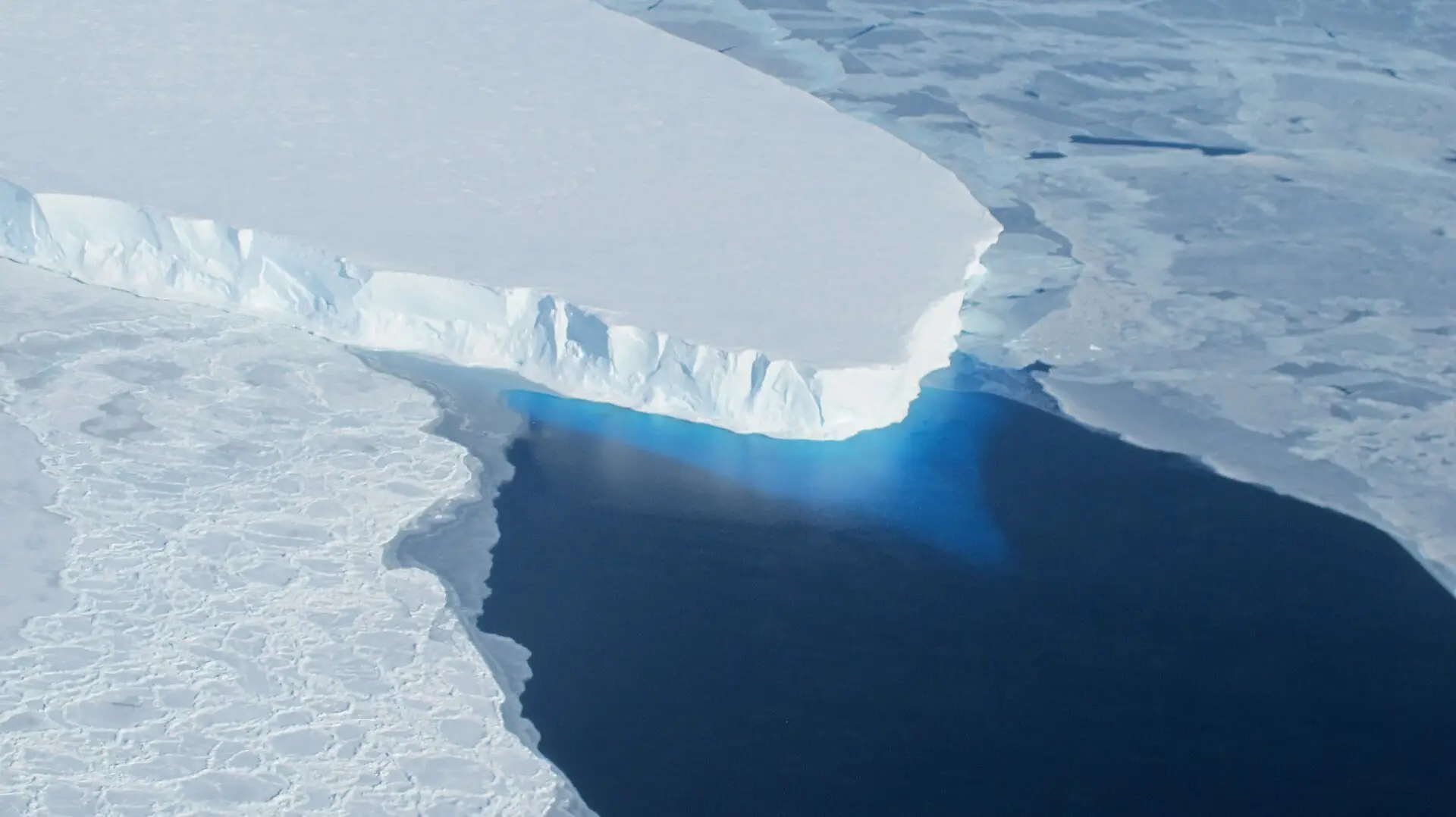 Aerial view of Thwaites Glacier’s ice edge and dark seawater in Antarctica, photographed in 2014
